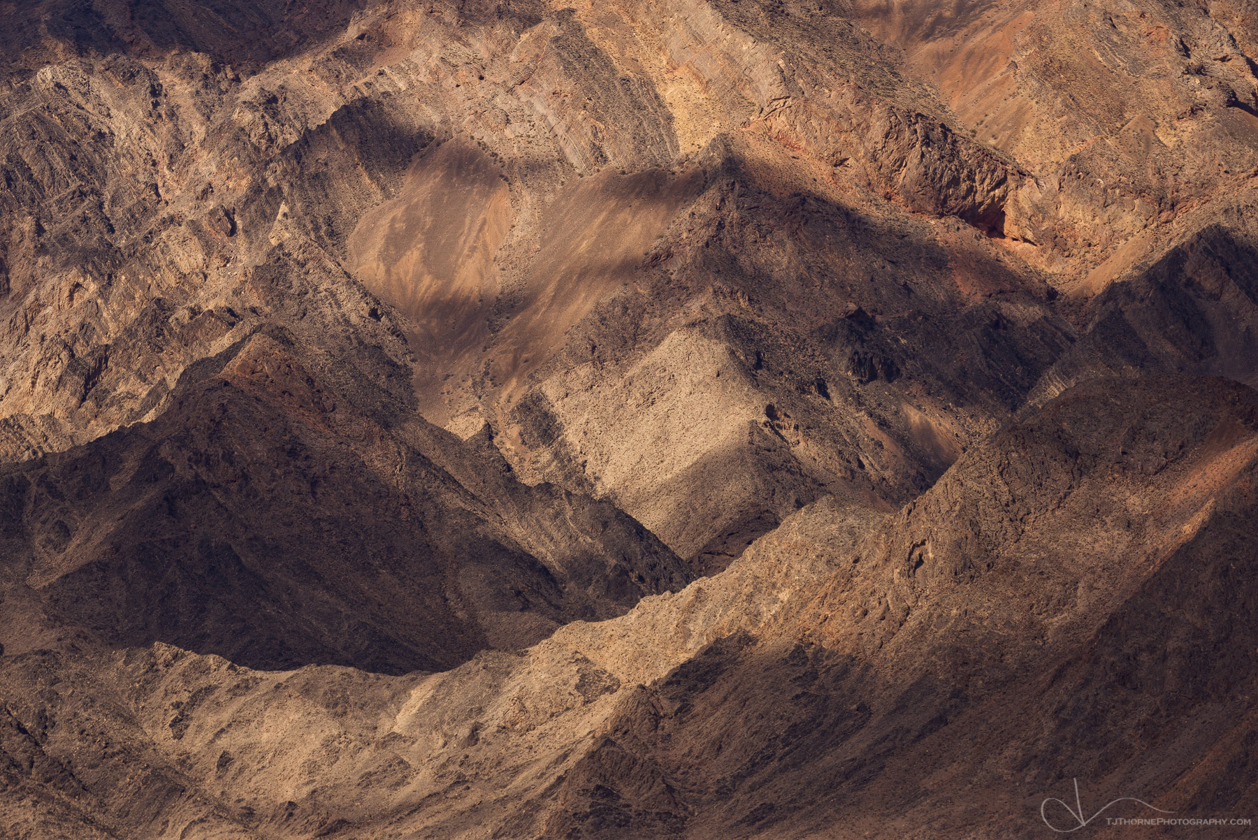 Dappled light on an intimate section of the Amargosa Mountains in Death Valley National Park.