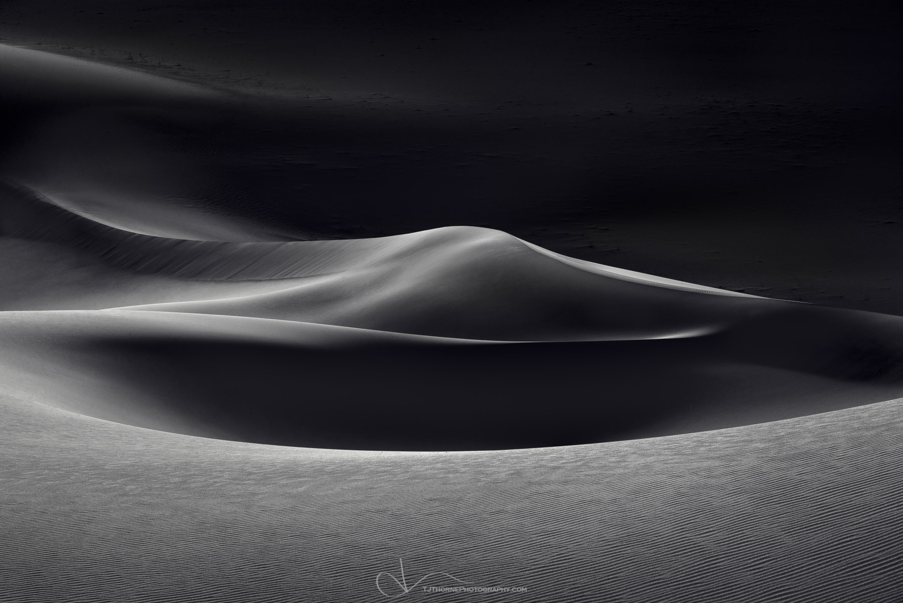 Evening light plays on some remote sand dunes in Death Valley National Park, California.